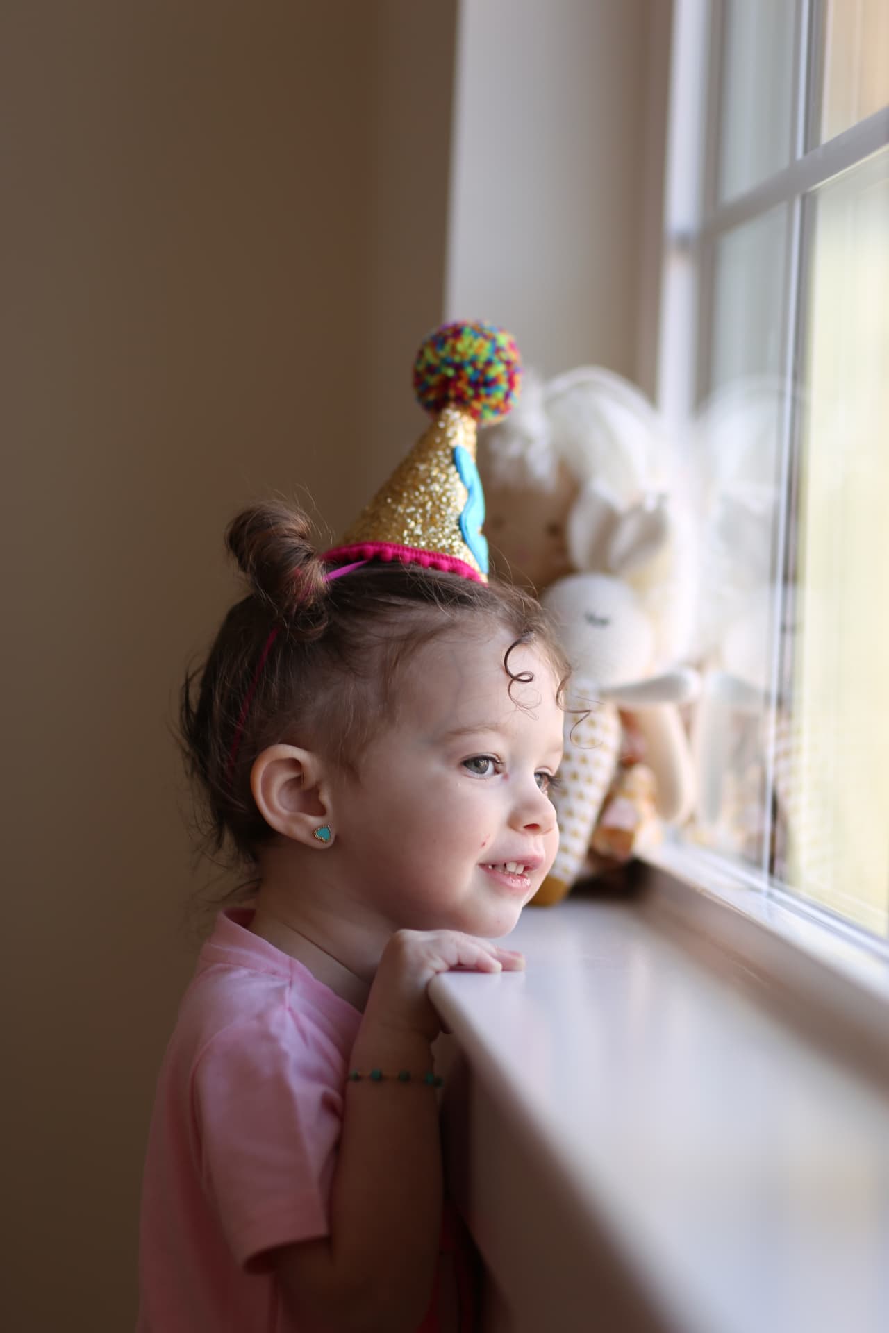 A birthday hat and a look out the window.