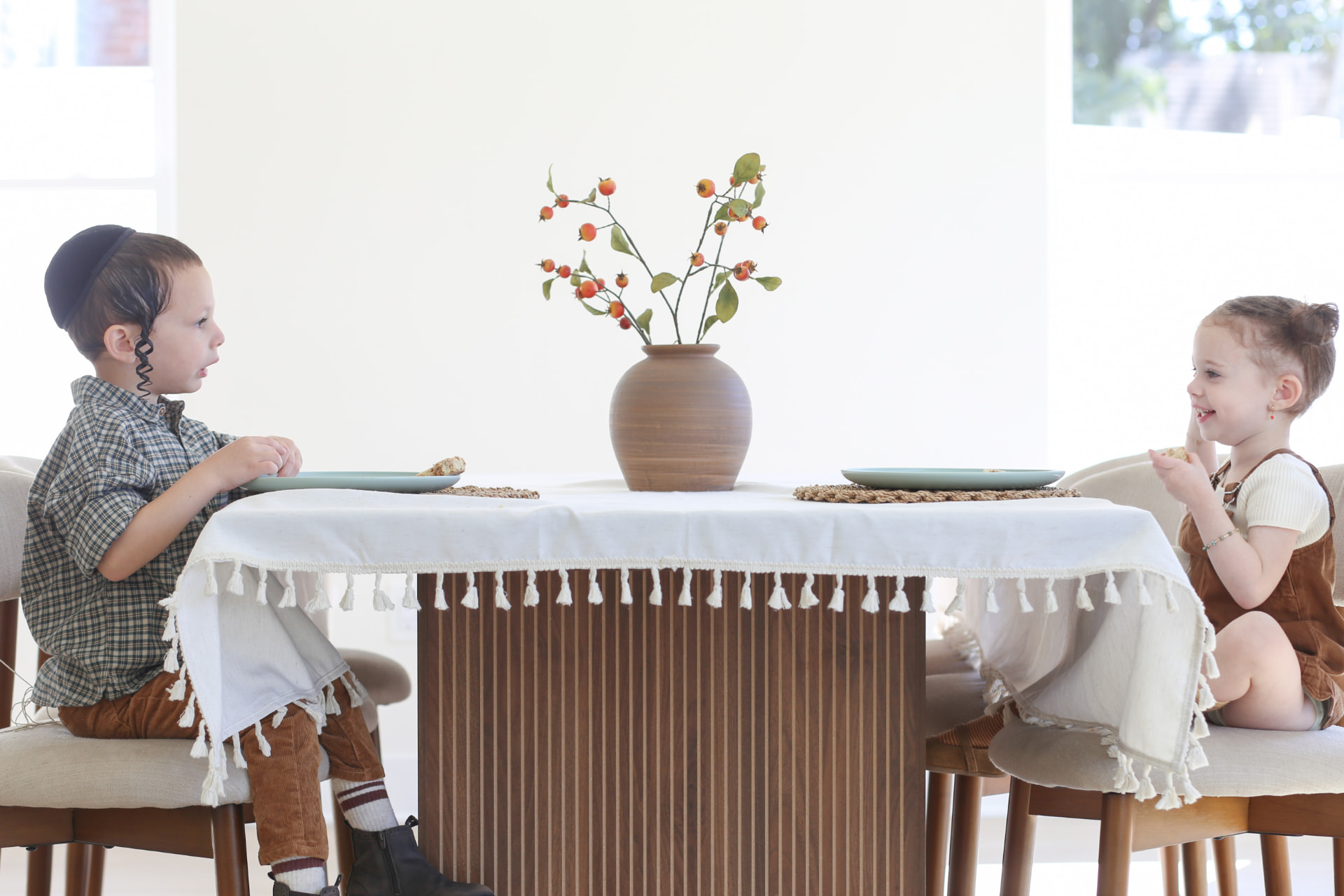 Two at the table, plates still empty.