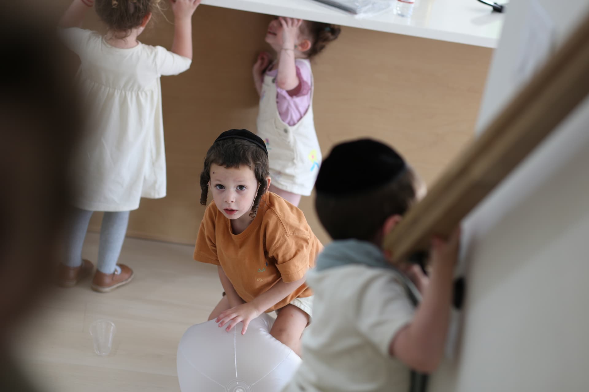 Everyone busy in the playroom at once.