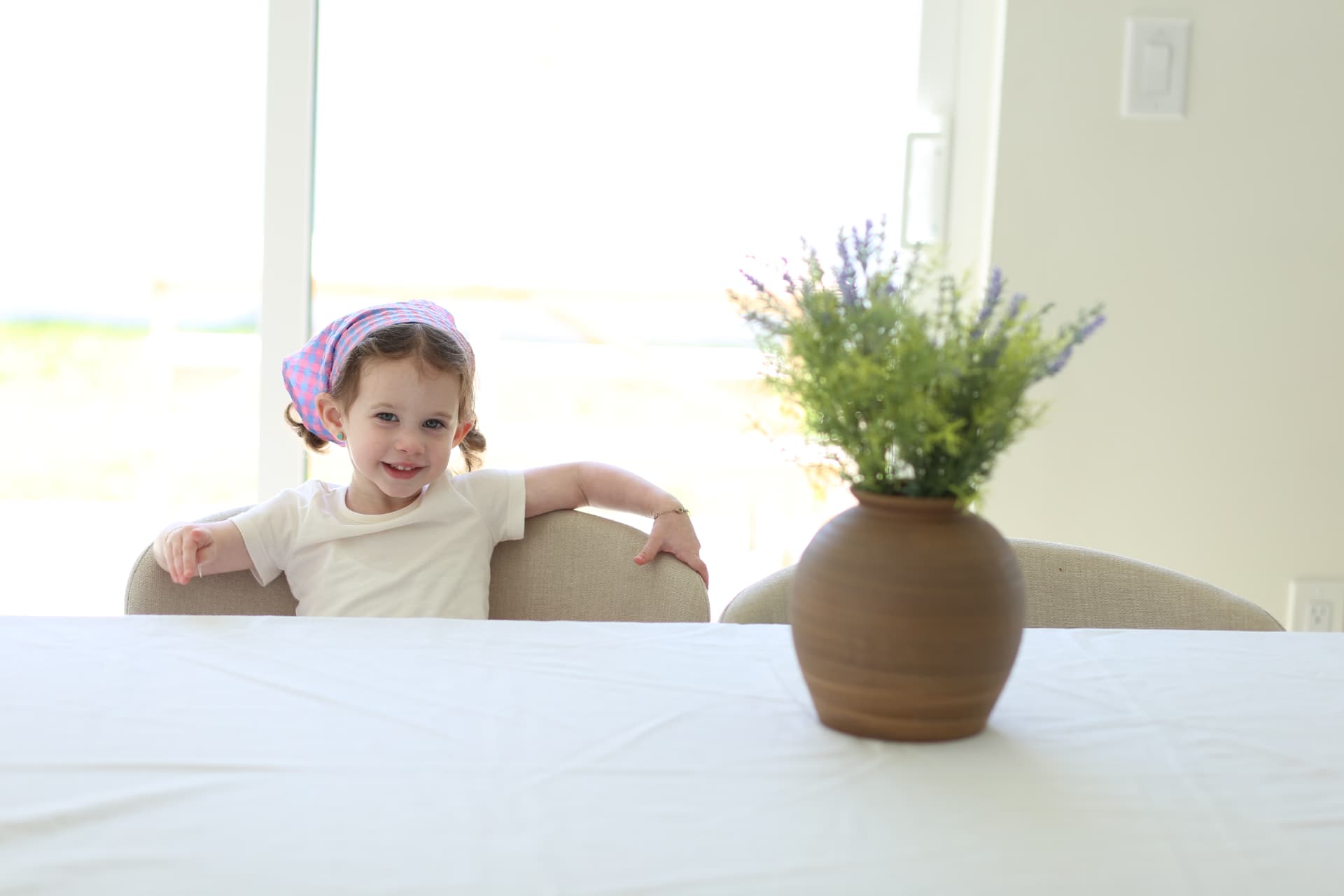 Settled in at the end of the table, all smiles.